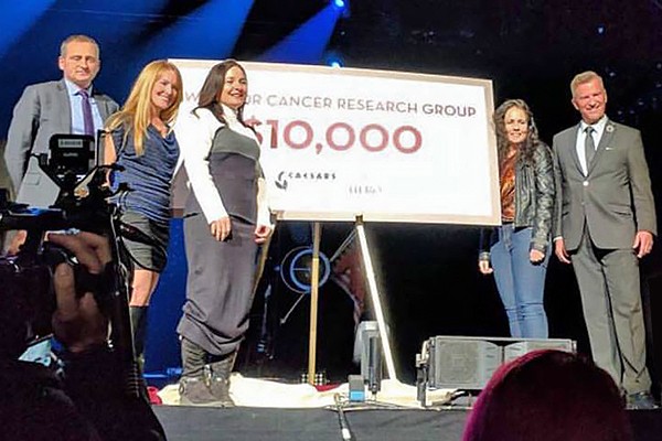 Representatives of the Windsor Cancer Research Group accept a $10,000 donation from Caesars Windsor during a cheque presentation Tuesday in the casino.