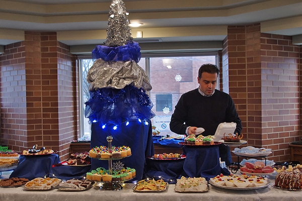 student confronts a table filled with treats