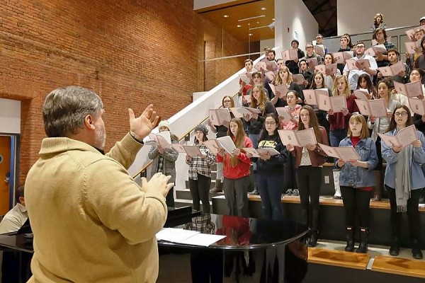 Choir director Bruce Kotowich leads a rehearsal
