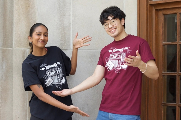 two people wearing CJAM T-shirts