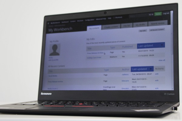 laptop displaying Drupal screens