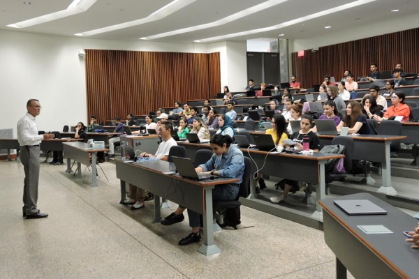 a professor lectures in front of an engineering class
