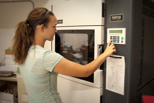 young woman appearing to do something technical