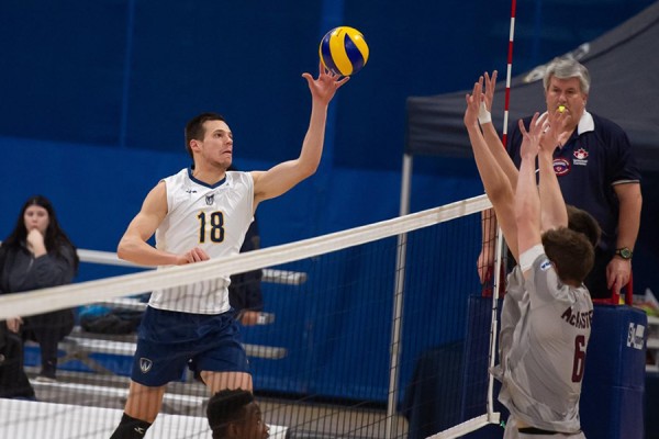 hitter Brad Gyemi makes a play at the net