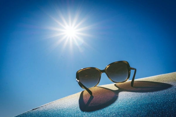 sunglasses set on sand