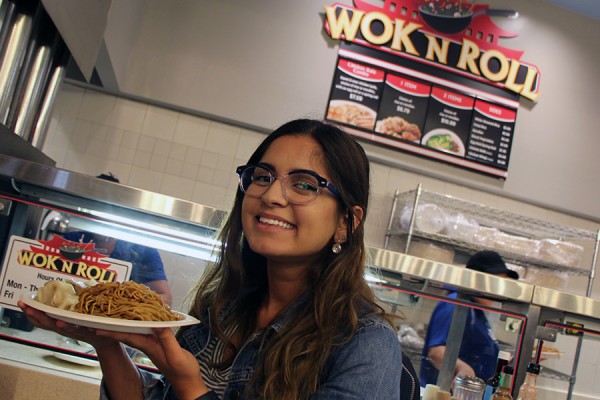 Law and politics student Katrina Bahnam looks forward to her lunch of vegetable pot stickers and lo mein from the Wok N Roll outlet in the Marketplace food court.