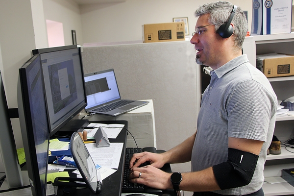 Kevin Macnaughton singing into computer mic