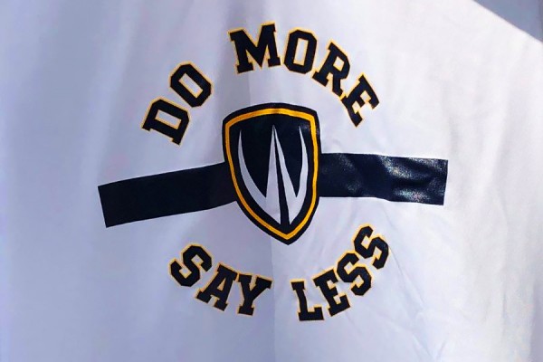 Image: Lancer shield with motto &quot;Do more, say less&quot;