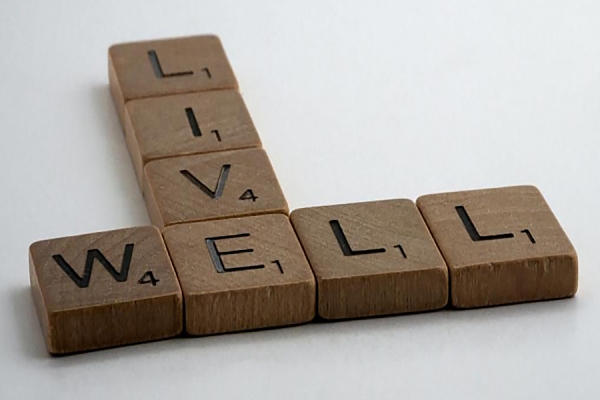 Scrabble tiles spelling &quot;Live Well&quot;