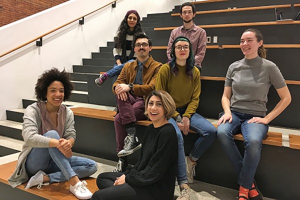 MFA students sitting on stairs