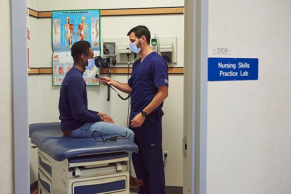 Nursing students working in lab