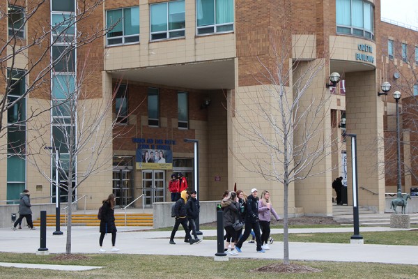 students walking past Odette Building