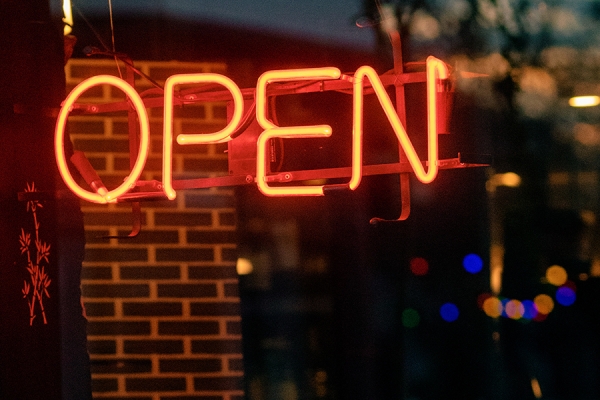 neon sign reading Open