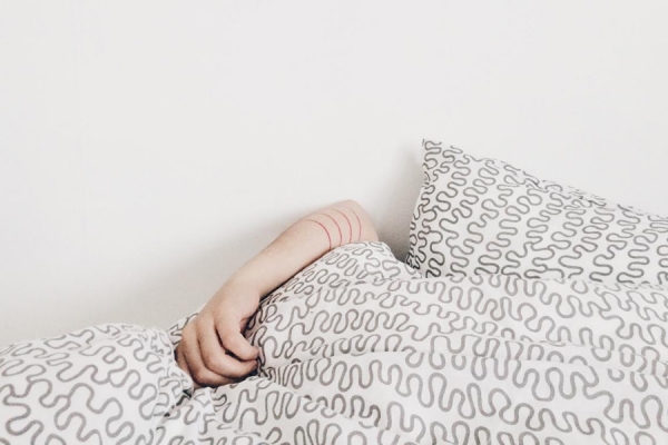 person clutching pillow