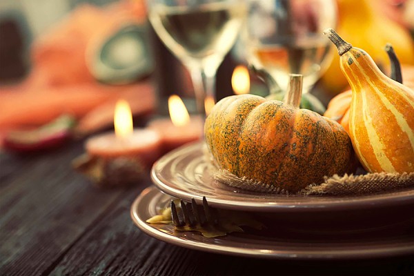 table set with autumnal gourds and such