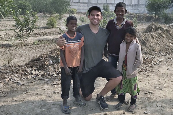 Dylan Verburg was often greeted by youngsters Kishan, Guddu, and Maya 