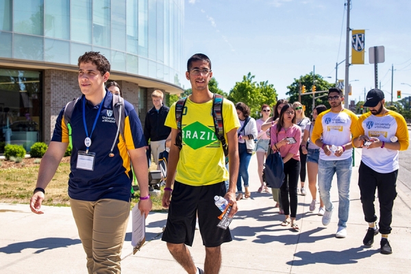 student ambassador leading campus tour