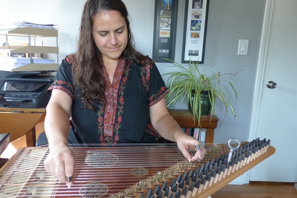 Victoria Abboud playing the qanun