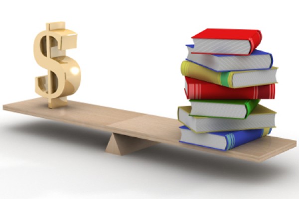 seesaw balancing money with stack of books