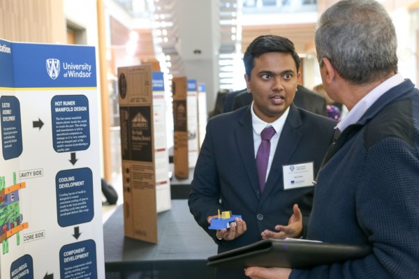 M. Eng student Neel Nitinkumar Shah describes his co-op experience at Windsor Mold Group during a poster presentation on Friday, Nov. 17, 2017