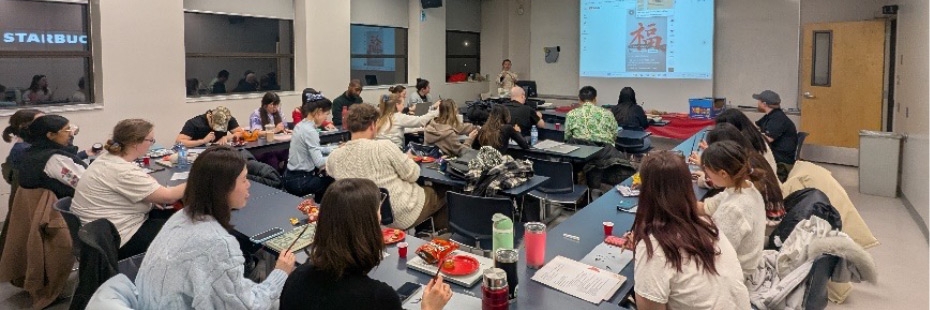 UWindsor teacher candidates learning Chinese calligraphy in a classroom