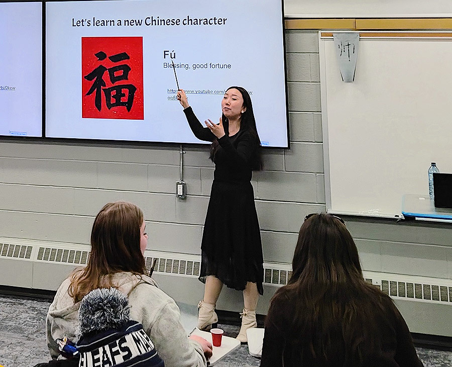 Dr. Yuhan Deng teaching the teacher candidates