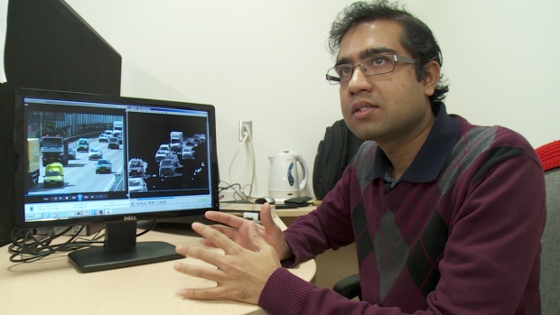 Dr. Dibyendu Mukherjee in front of his computer