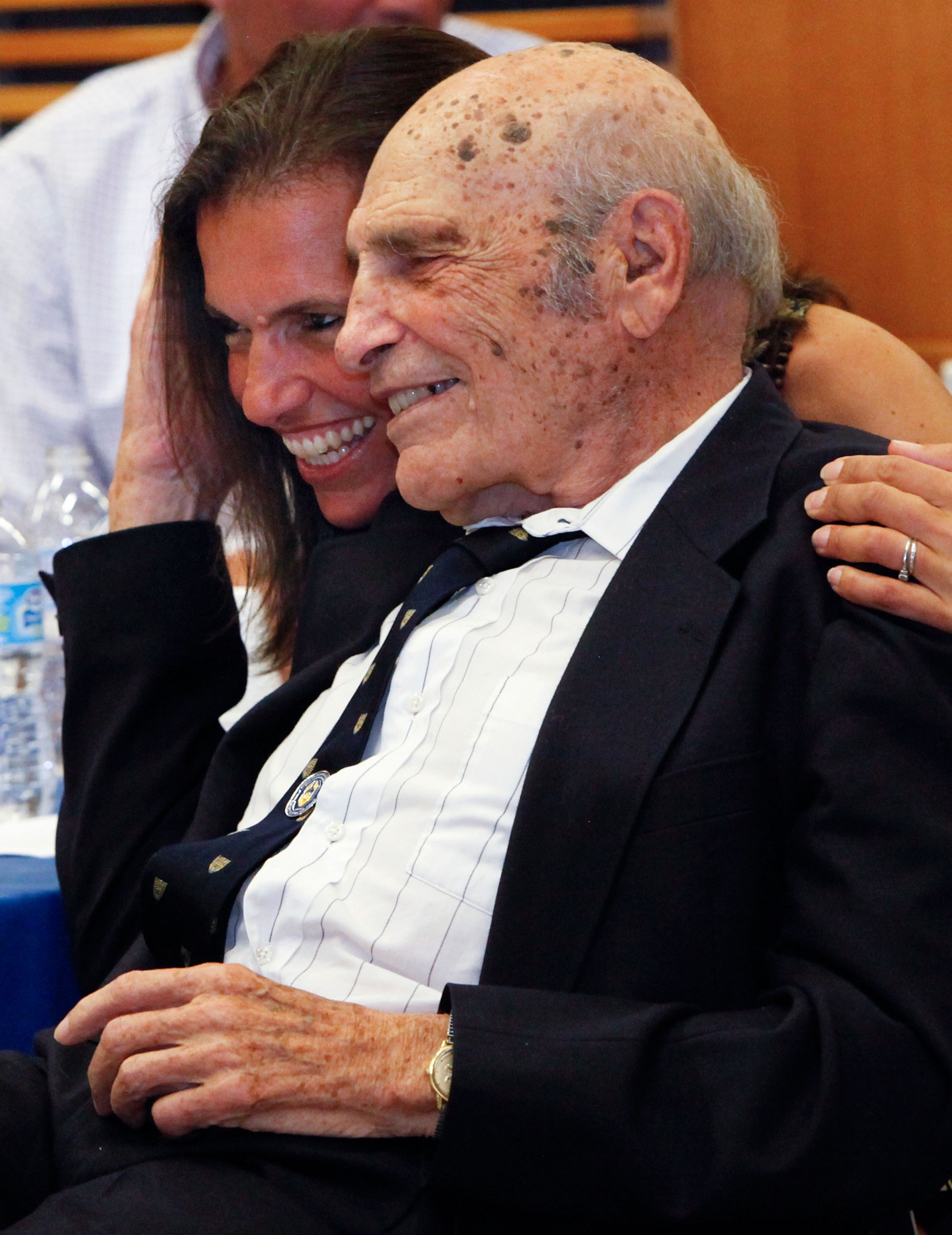 Dr. Frank A. DeMarco embraces his daughter, Terry DeMarco, during a lab naming ceremony on May 28, 2016 at the Ed Lumley Centre for Engineering Innovation.