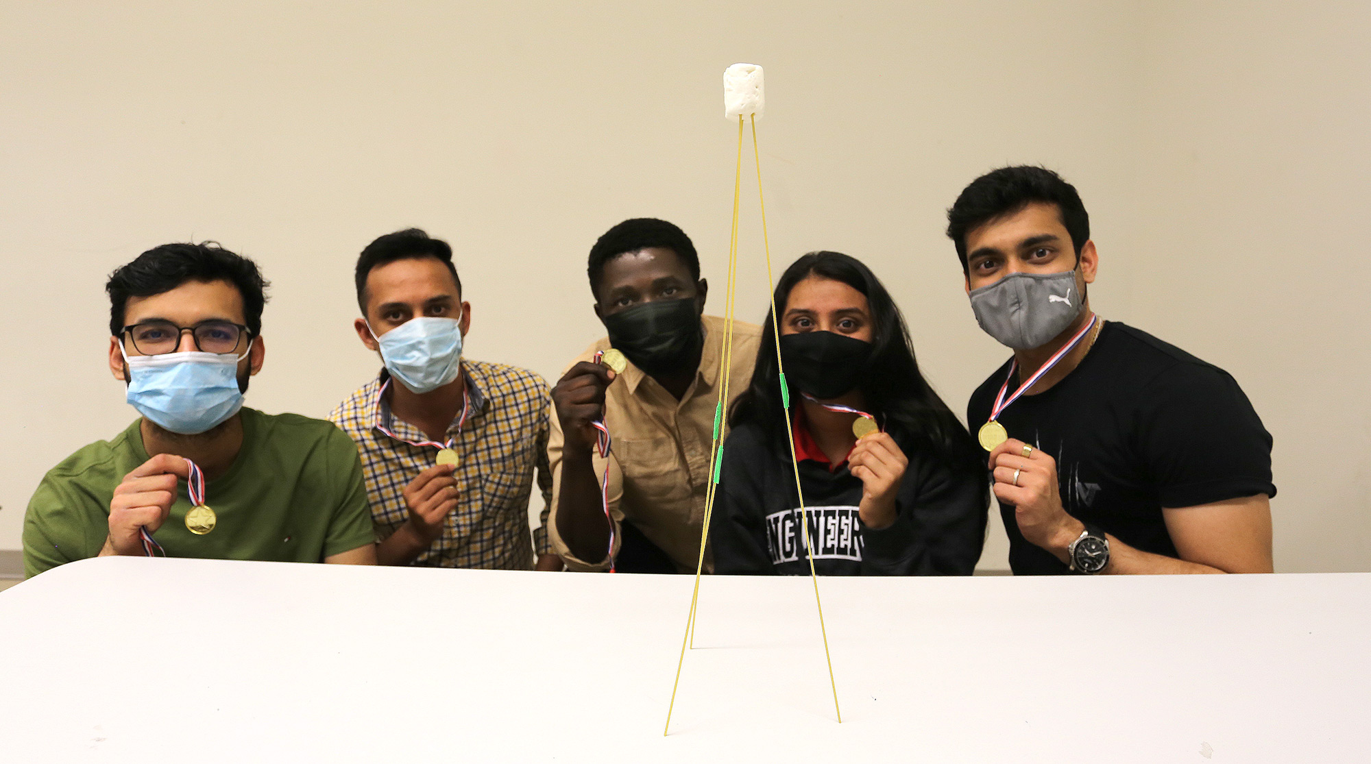 MEng mentors Dhruvil Vyas, Sagar Patel, Emmanuel Ugwuozor, Moxa Patel, and Parantap Vakharwala showcase their winning “tallest marshmallow tower.”
