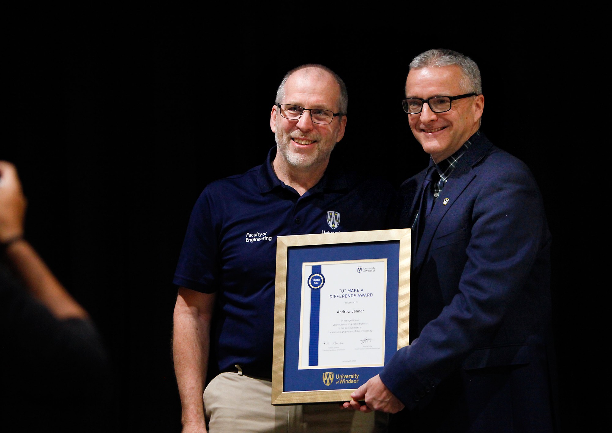 Andrew Jenner receives the the “U” Make a Difference Award from President