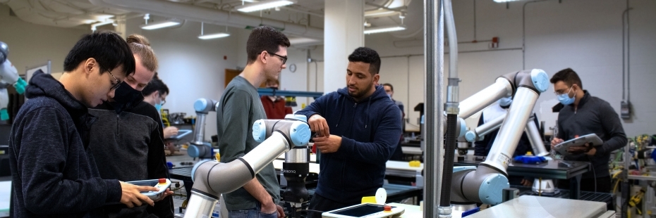 group working on machines in mechatronics lab