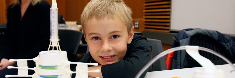 A child displays an engineering activity