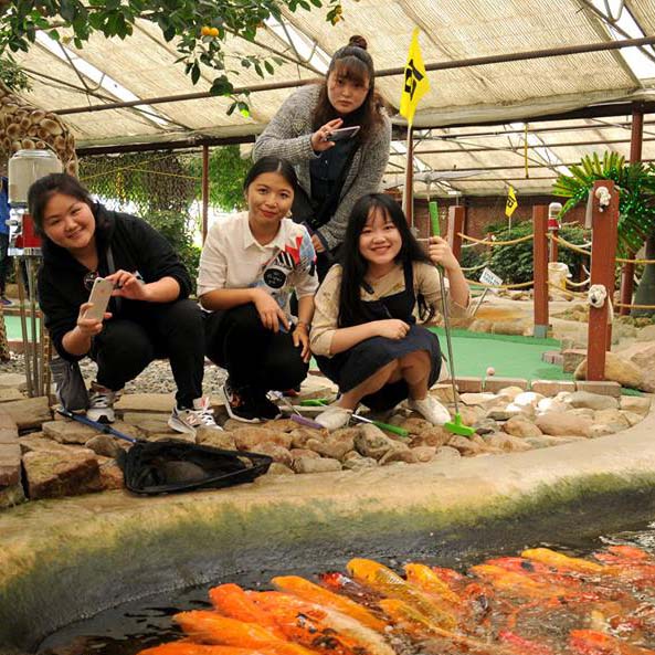 students on mini-golf course