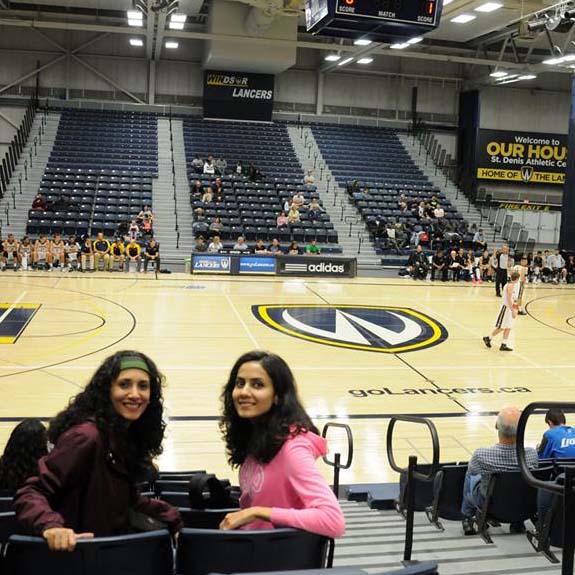 students at basketball game