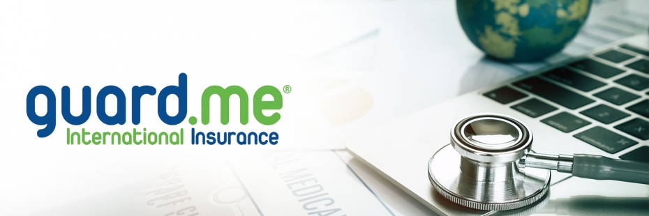 image of health insurance papers on desk with laptop, stethoscope and globe in the background with guard me logo