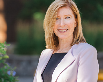 Dr. Cheryl Collier, Dean of FAHSS standing in the Quad