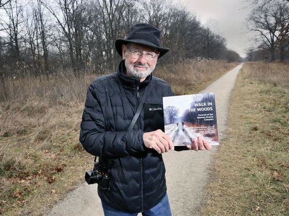  Marty Gervais, Windsor's Poet Laureate Emeritus is shown at the Ojibway Prairie Complex on Thursday, December 9, 2021, with a book he collaborated on entitled "Walk in the Woods: Portrait of the Ojibway Prairie Complex. Photo by Dan Janisse /The Windsor Star 