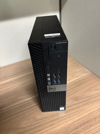 Black Dell desk top computer standing