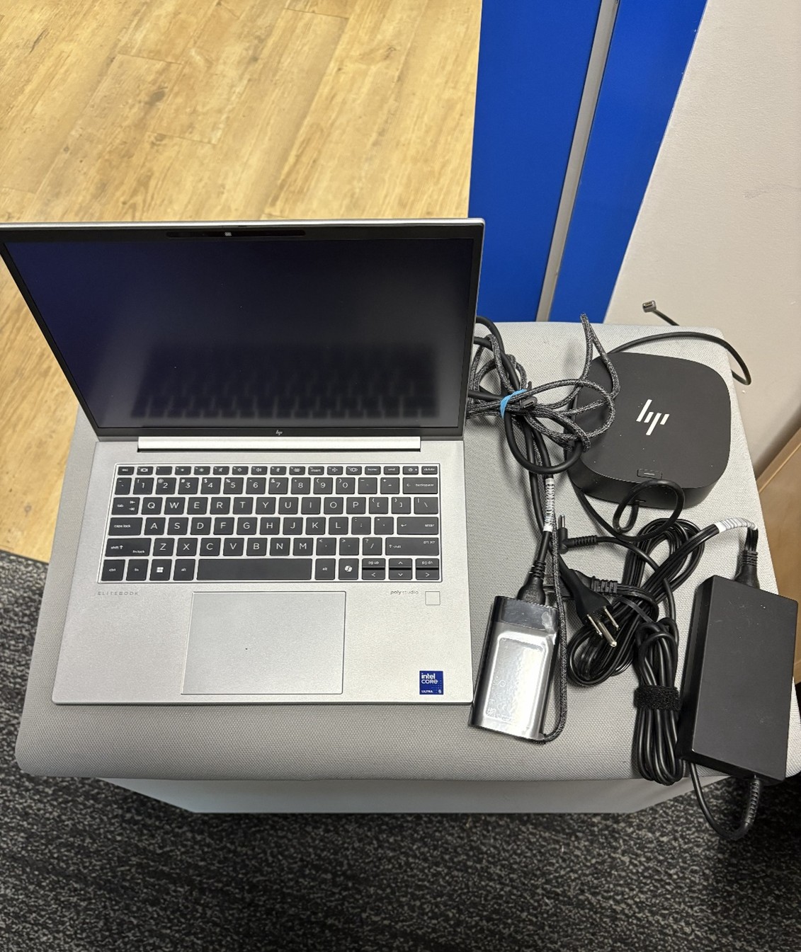 silver laptop, black docking station