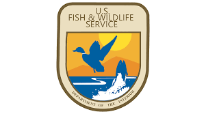 U.S. Fish and Wildlife Service Logo with a duck and fish over water