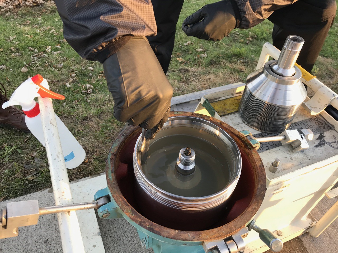researchers processing water samples near a stream