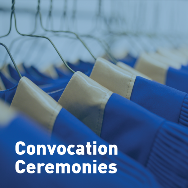 Convocation gowns on clothes hangers