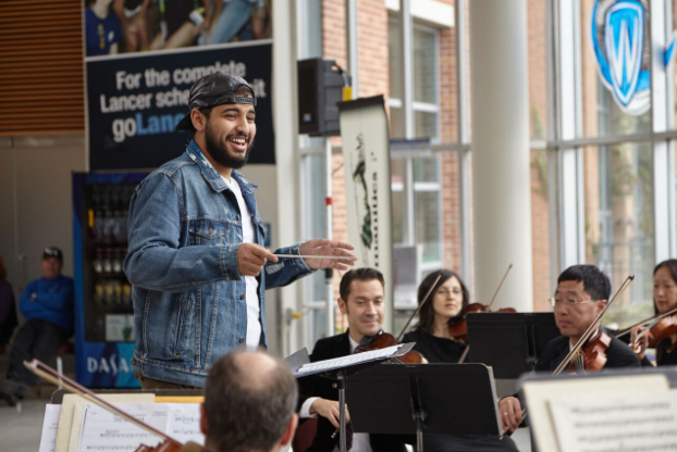 Student tries something new -- conducting an orchestra!