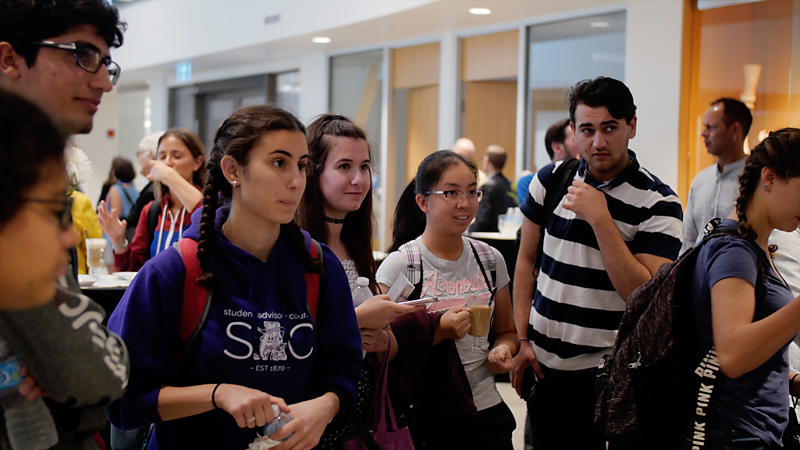 Students gather to talk to HRG guest speaker after presnetation