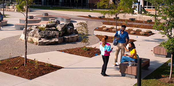 Group of 3 student outdoor near Turtle Island sculpture
