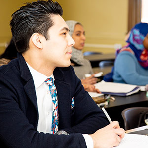 Closeup sideview of student in Indigenous student in business attire