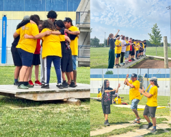 Youth and mentors at summer camp doing a challenge coarse
