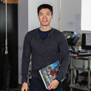 Student smiling in graduate research room