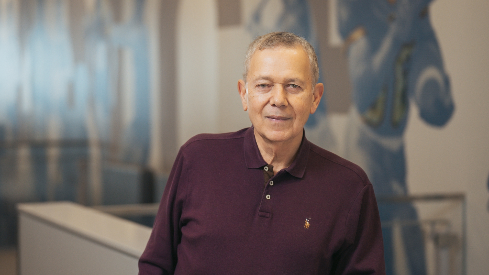 A person in a burgundy shirt 