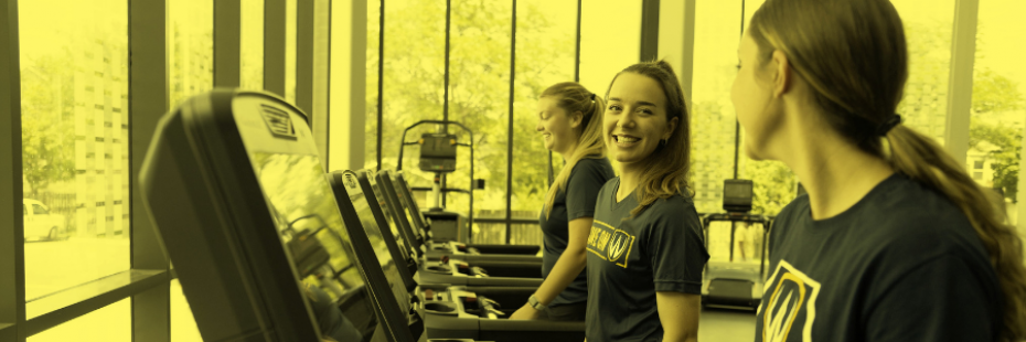 three girls running on a treadmill, smiling, at Toldo Lancer Centre